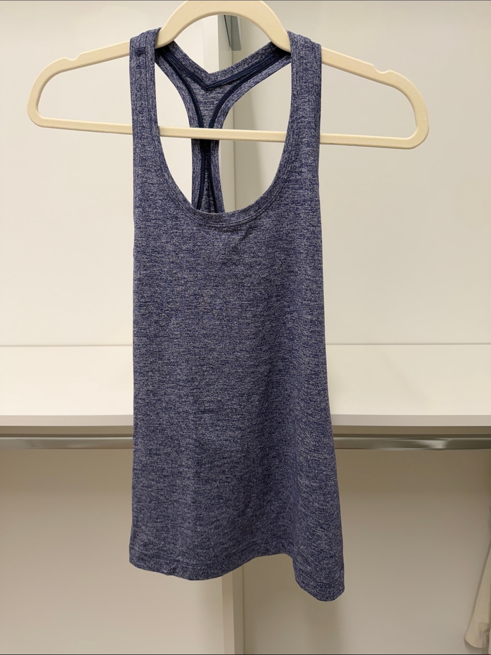 Lululemon racerback tank. Heather blue. Like new. Worn once size 6.